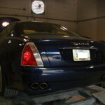 Before and after photographs of a damaged, blue, Maserati that was repaired by Elite Paint & Body Shop in West Palm Beach, FL.